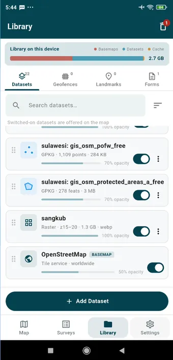 Library &rsaquo; Datasets: the OpenStreetMap basemap (a tile service, here at 50 % opacity), a 1.3 GB MBTiles raster of orthophotos at zoom 15&ndash;20, and vector datasets. The bar at the top is what the library takes on the device.